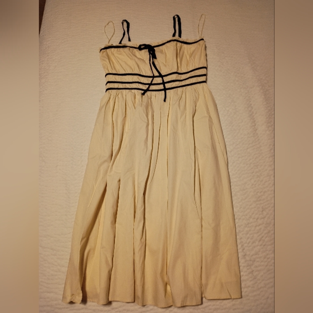 Elegant Cream Dress with Black Accents